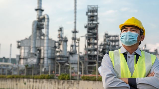refinery industry engineer wearing protective face mask